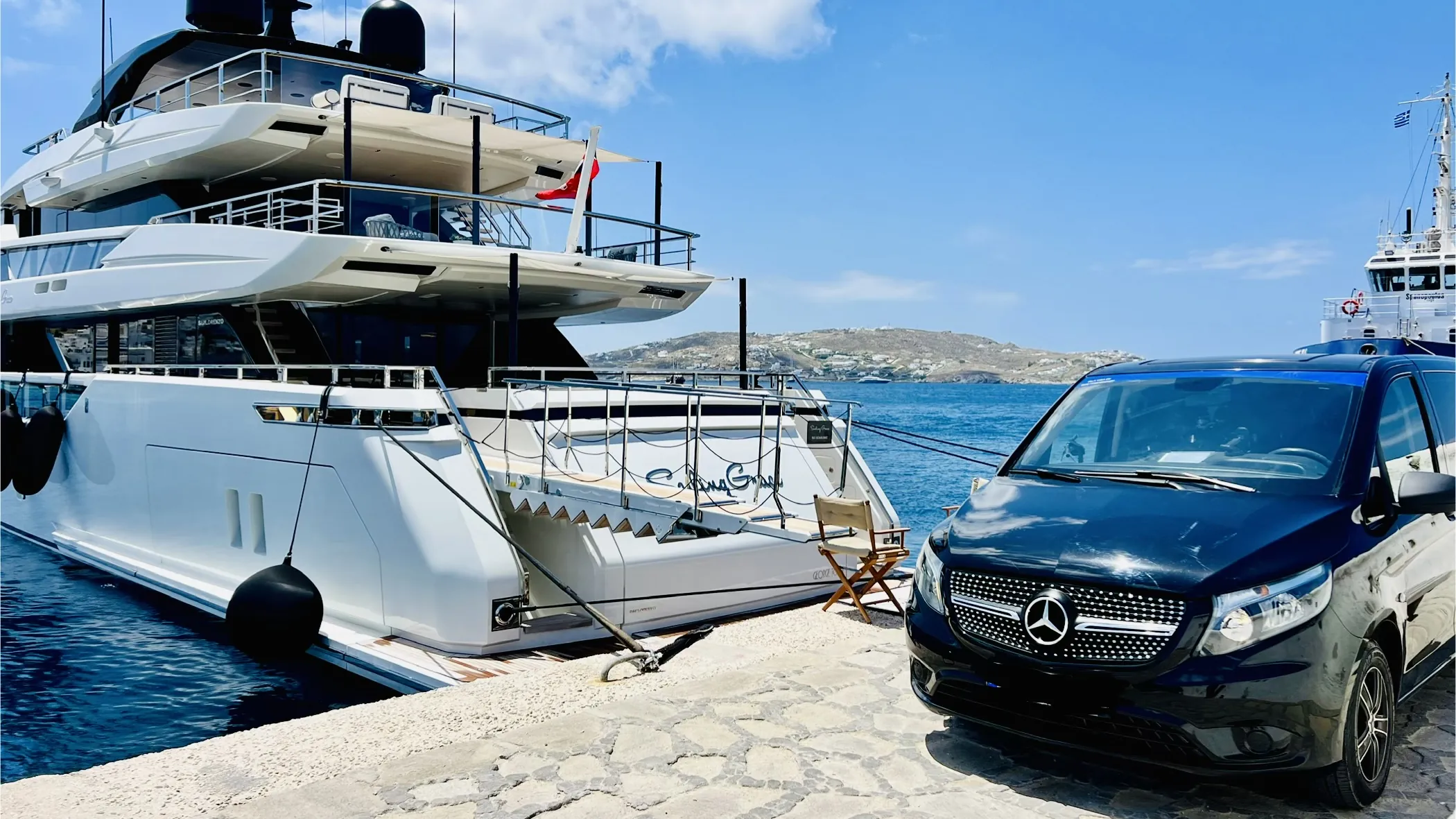 Mercedes luxury van waiting on the quay at Mykonos port