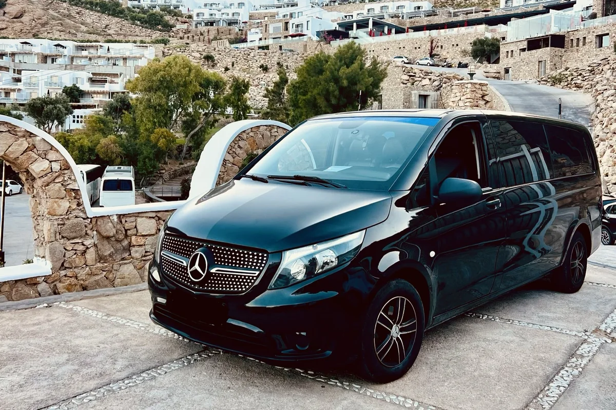 Black Mercedes transfer van waiting at a hillside hotel in Mykonos